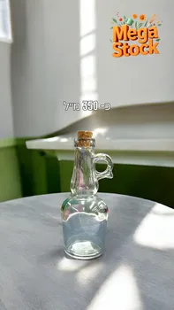 בקבוק זכוכית שקוף בנפח כ-350 מ"ל